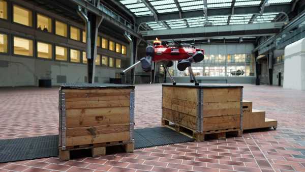 ANYmal climbing over wooden boxes