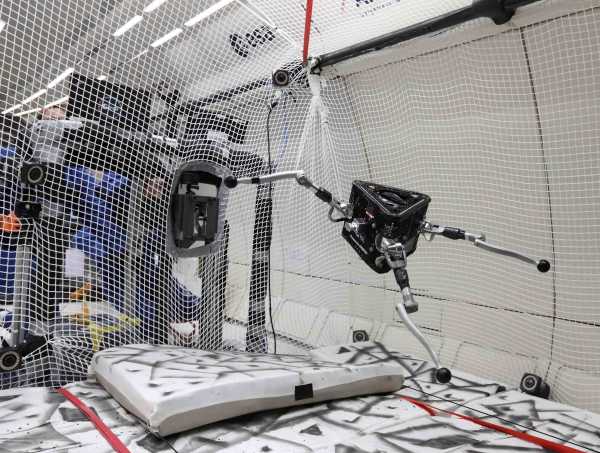 space robot is getting tested in an open space